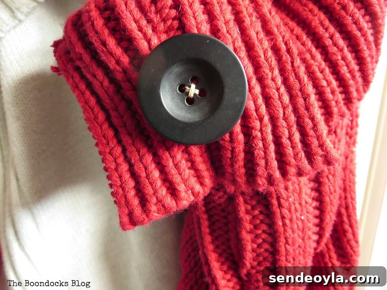 How to Make Christmas Stockings from Old Sweaters 8 black button on the red stocking, How to Make Easy Christmas Stockings from Sweaters