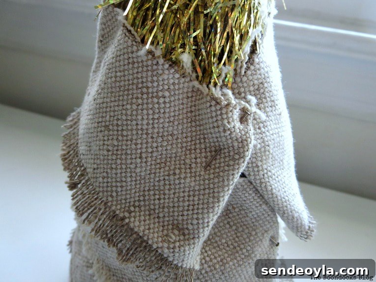 DIY Mini Christmas Tree from Dollar Store Fabric 6 Fabric scrap pinned to back of tinsel tree.