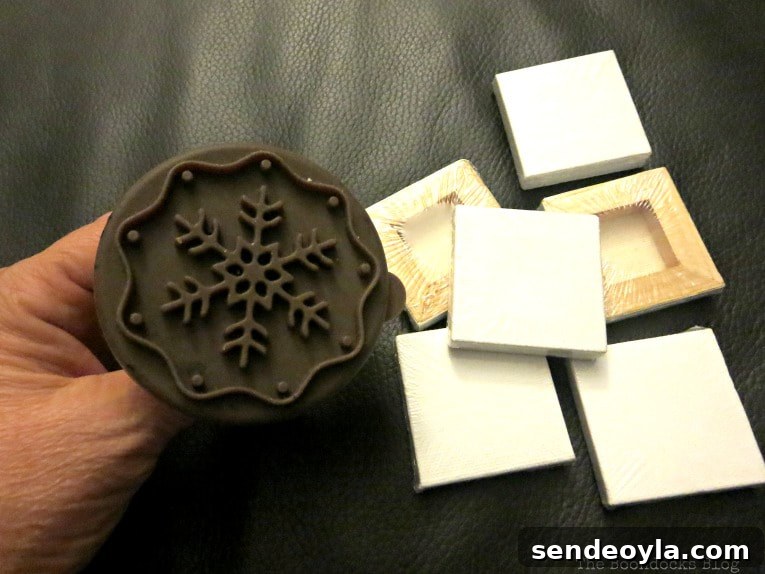 DIY Snowflake Mini Canvas Ornaments for Holiday Decor 3 Materials used, mini canvas and cookie cutter, How to Make Easy Snowflake Mini Canvas Ornaments www.theboondocksblog.com