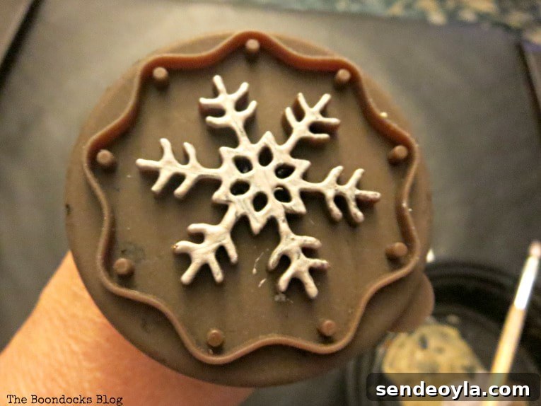 DIY Snowflake Mini Canvas Ornaments for Holiday Decor 4 Cookie cutter with paint on, How to Make Easy Snowflake Mini Canvas Ornaments www.theboondocksblog.com