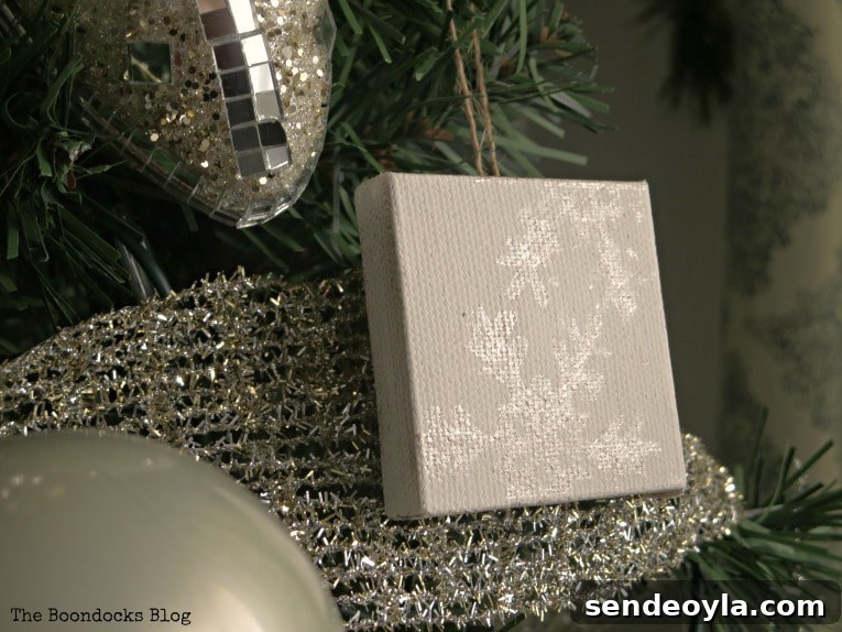 DIY Snowflake Mini Canvas Ornaments for Holiday Decor 7 snowflake design shining on mini canvas, How to Make Easy Snowflake Mini Canvas Ornaments www.theboondocksblog.com
