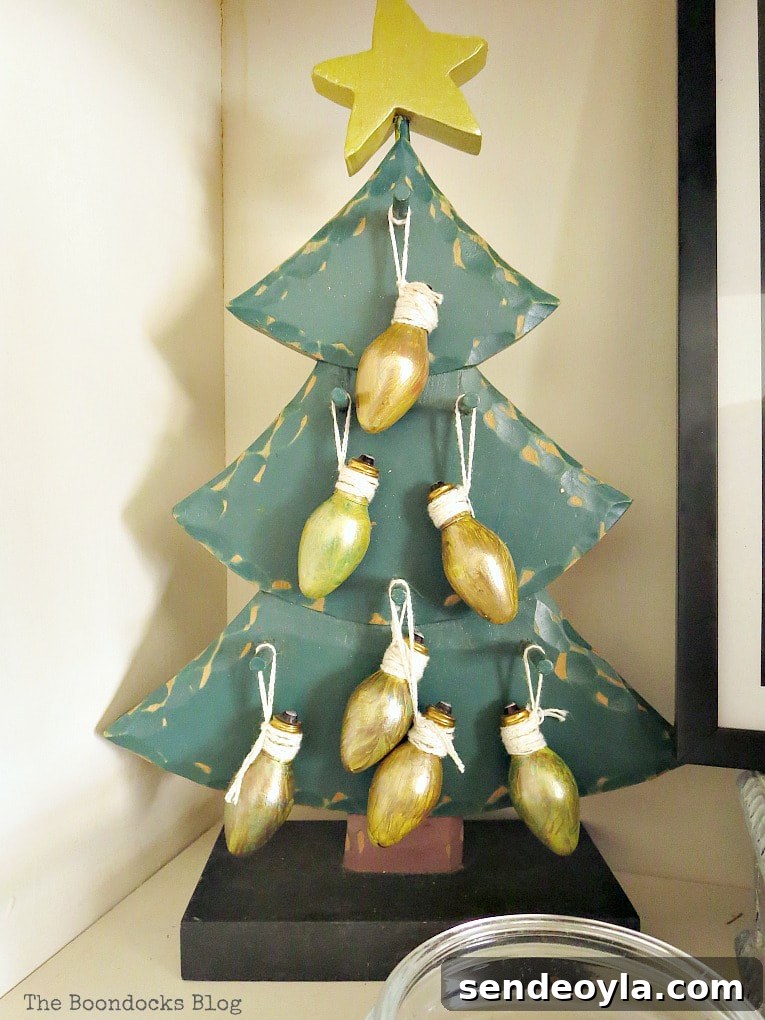 Upcycle Old Decor into Bright Christmas Vignettes 12 Green wooden tree with light bulbs painted gold, How to Reuse Old Decor to Make Bright Christmas Vignettes www.theboondocksblog.com