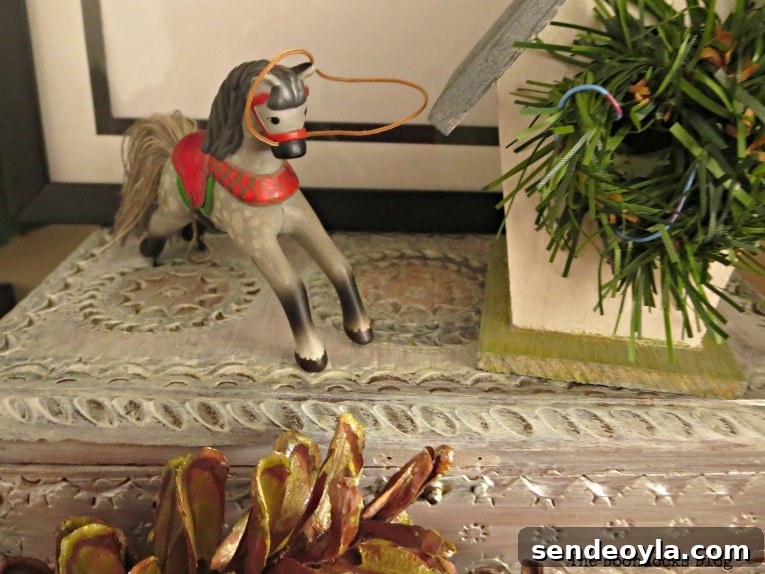 Upcycle Old Decor into Bright Christmas Vignettes 14 Horse ornament on top of vintage jewelry box, How to Reuse Old Decor to Make Bright Christmas Vignettes www.theboondocksblog.com
