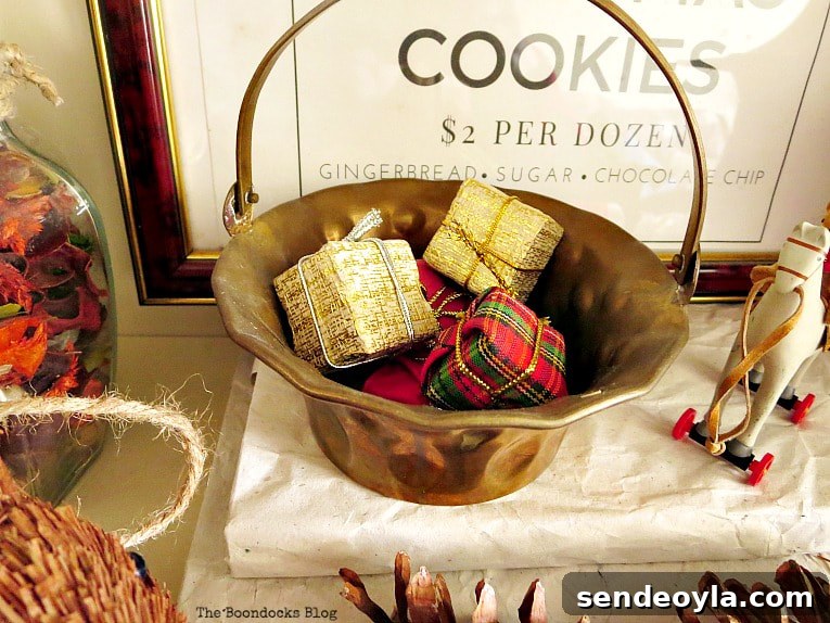 Upcycle Old Decor into Bright Christmas Vignettes 17 tiny presents inside brass basket, How to Reuse Old Decor to Make Bright Christmas Vignettes www.theboondocksblog.com