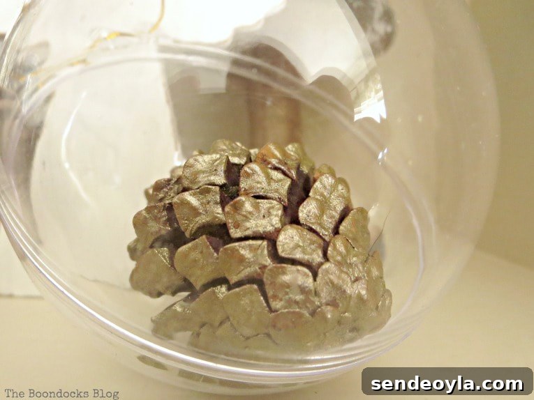 Upcycle Old Decor into Bright Christmas Vignettes 5 Clear plastic ornament with pine cone inside, How to Reuse Old Decor to Make Bright Christmas Vignettes www.theboondocksblog.com
