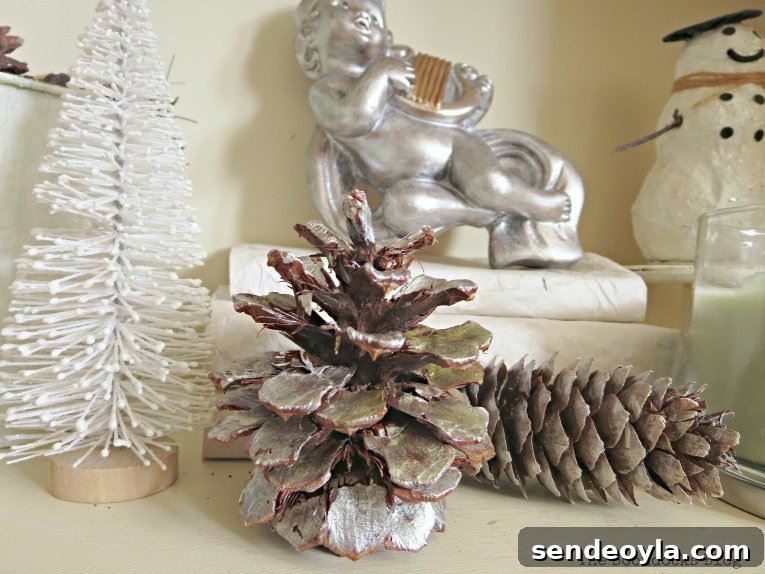 Upcycle Old Decor into Bright Christmas Vignettes 8 Pine cones painted silver and bottle brush tree, How to Reuse Old Decor to Make Bright Christmas Vignettes www.theboondocksblog.com