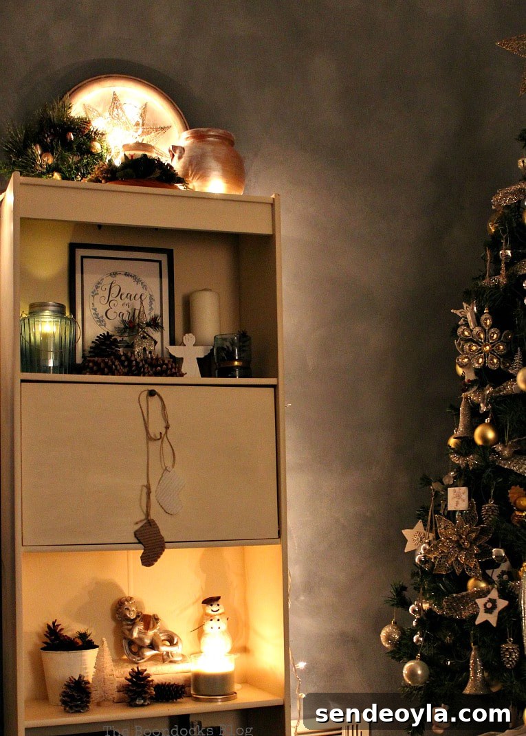 Upcycle Old Decor into Bright Christmas Vignettes 10 Nighttime view of bookcase, How to Reuse Old Decor to Make Bright Christmas Vignettes www.theboondocksblog.com