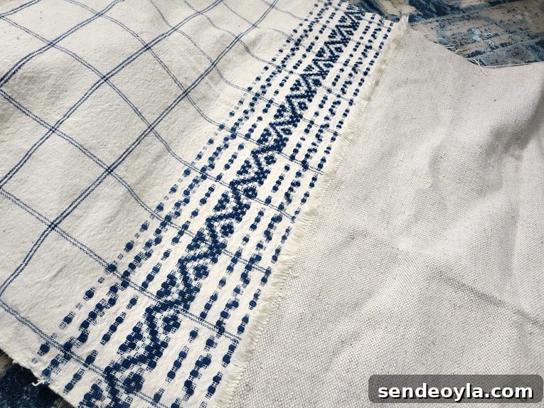 DIY Throw Pillows from Fabric Scraps: 5 Creative Ideas 14 blue and white tea towel, How to Make Easy Pillows out of Fabric Remnants 5 ways www.theboondocksblog.com