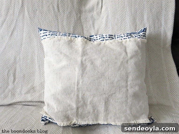 DIY Throw Pillows from Fabric Scraps: 5 Creative Ideas 17 finished pillow with linen on one side. How to Make Easy Pillows out of Fabric Remnants 5 ways www.theboondocksblog.com