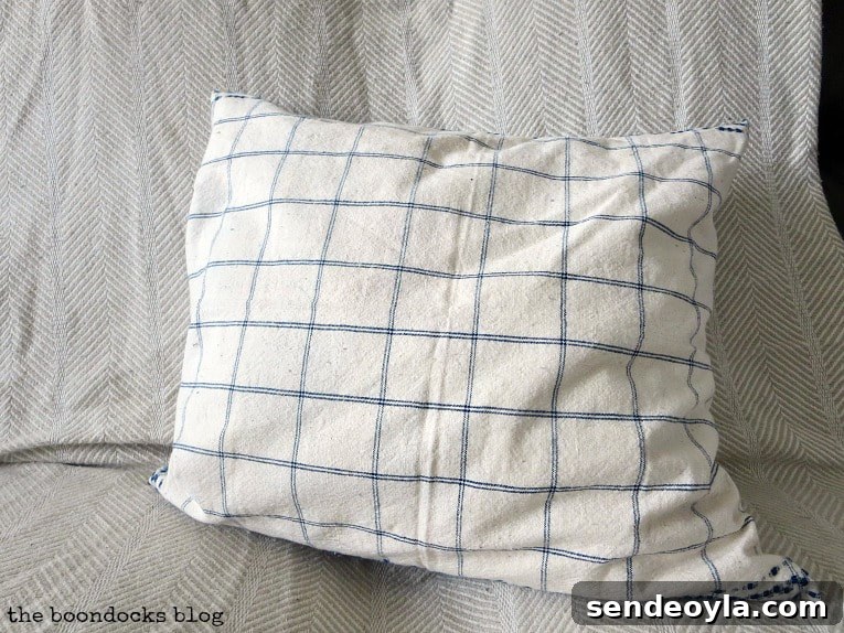 DIY Throw Pillows from Fabric Scraps: 5 Creative Ideas 18 Finished pillow with blue and white check on the other side, How to Make Easy Pillows out of Fabric Remnants 5 ways www.theboondocksblog.com