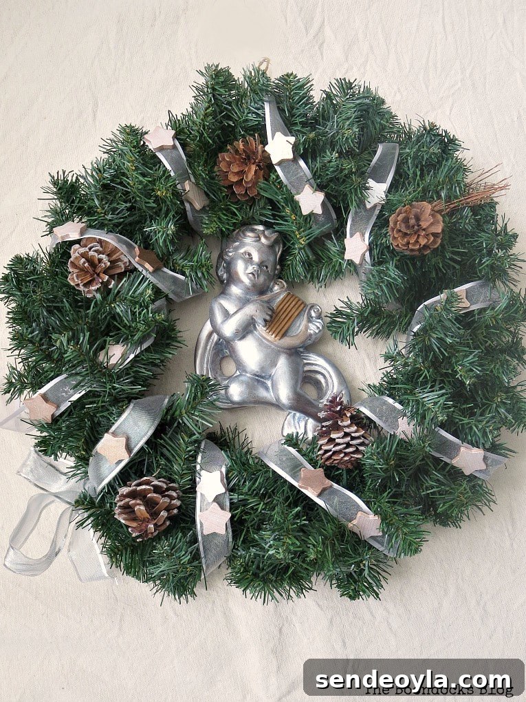 wreath with cherub and metallic accents