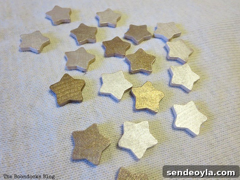 wood stars painted with metallic paint
