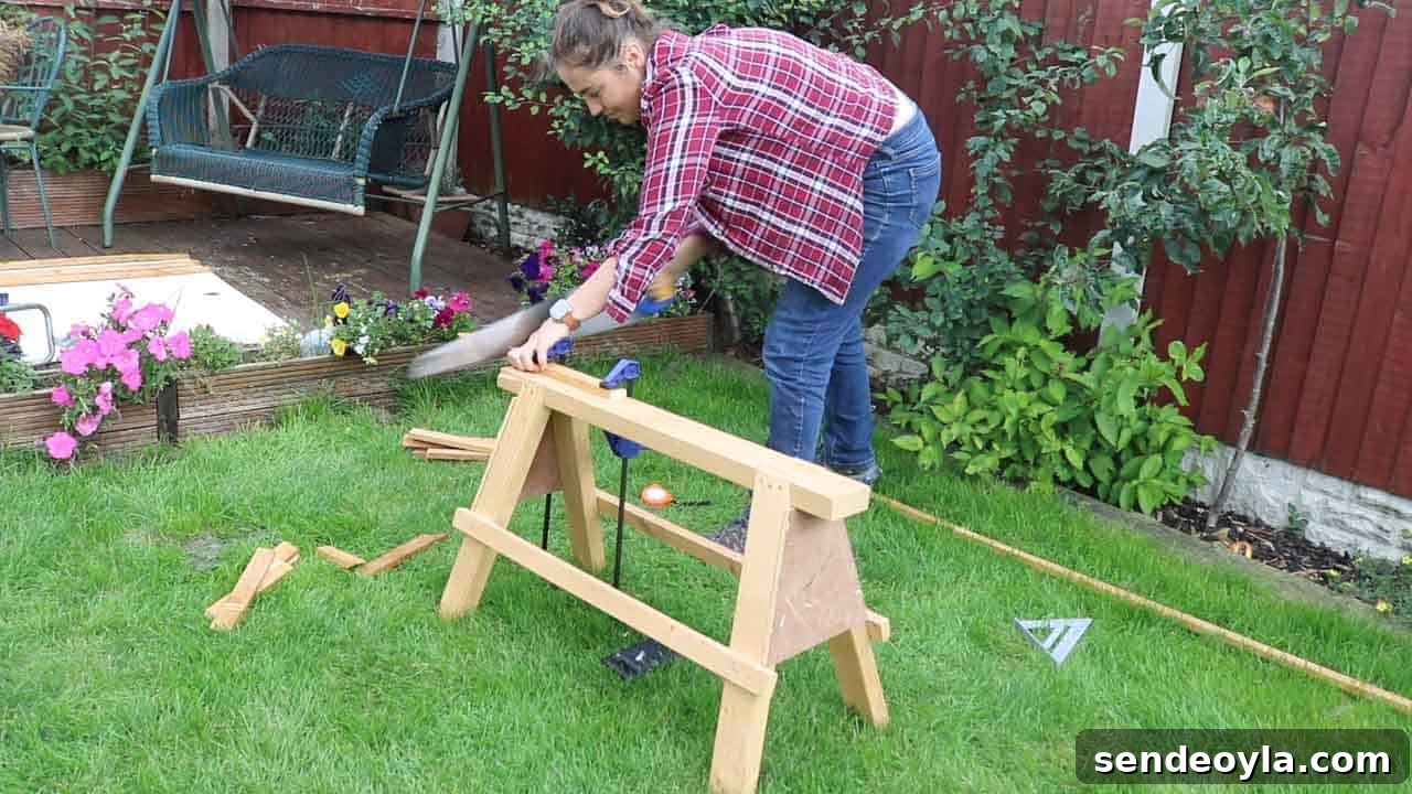 How to Build and Install a Wooden Trellis 13 cutting trellis strips with handsaw while clamped to saw horse