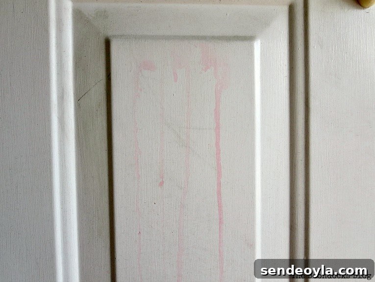 Paint Your Front Door for a Durable, Professional Finish 3 Door before streaked with red dye