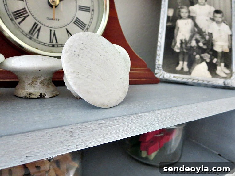 How to Add a Metallic Finish to a Painted Wood Shelf 12 Objects on shelf, A Super Easy Way to Add Shimmer to a Shelf, theboondocksblog