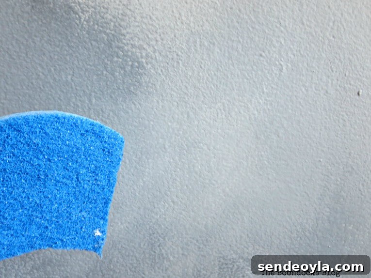 How to Paint a Cloud Accent Wall: DIY Step-by-Step Guide 11 Paint clouds with a sponge by blending the dried paint.