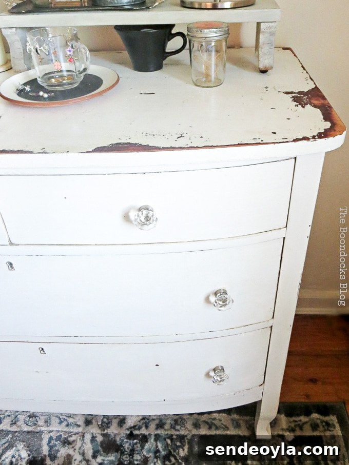 How to Make Furniture Shine with Crystal Dresser Knobs 12 white distressed vintage dresser with glass knobs, #dresser #vintagefurniture #glassknobs #distressedfurniture #bling #shinyknobs How to Make your Dresser Sparkle with Age www.theboondocksblog.com