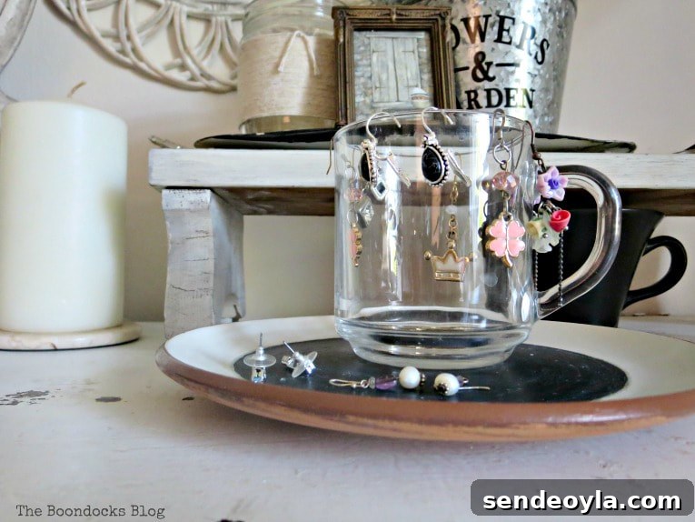 How to Make Furniture Shine with Crystal Dresser Knobs 11 glass cup used to hold drop earrings, #dresser #vintagefurniture #glassknobs #distressedfurniture #bling #shinyknobs How to Make your Dresser Sparkle with Age www.theboondocksblog.com