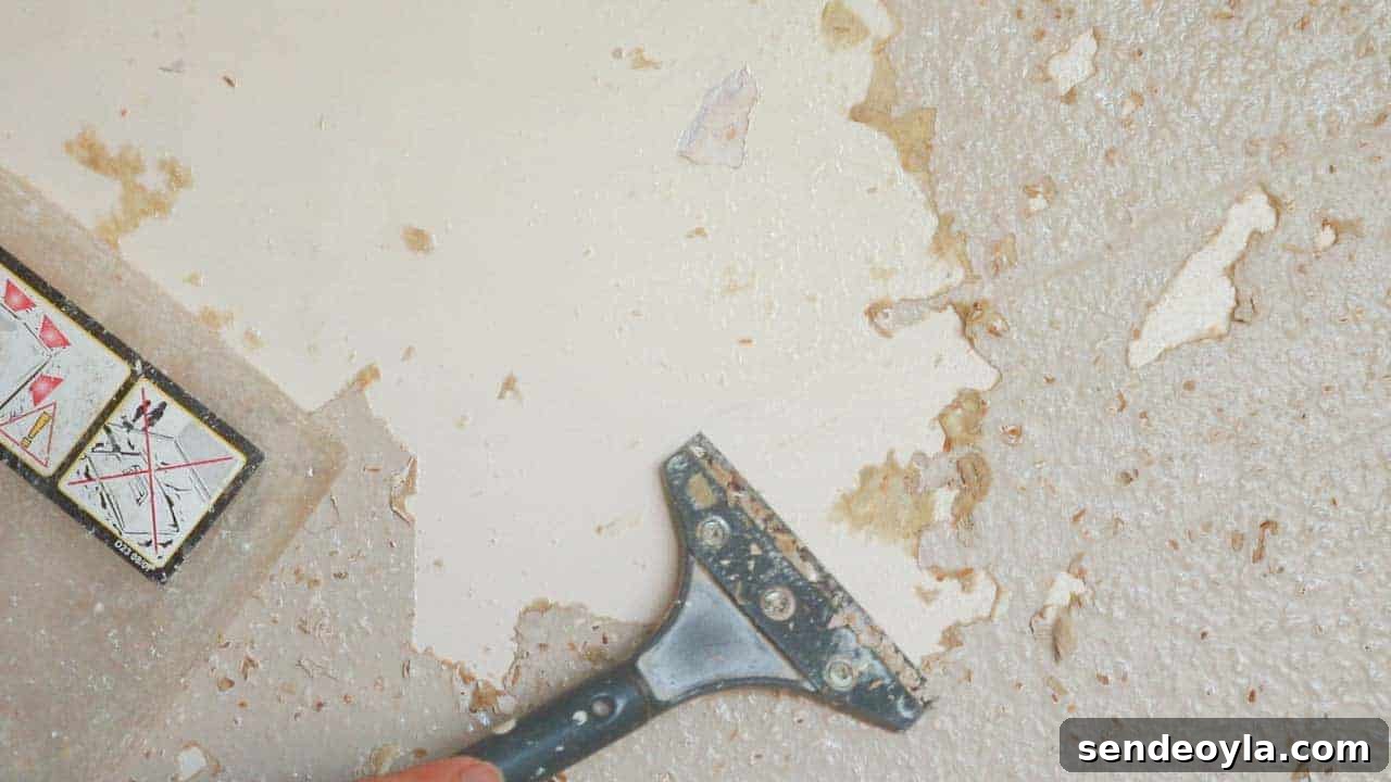 How to Use a Wallpaper Stripper to Remove Old Wallpaper 3 Removing woodchip wallpaper with a scraper and wallpaper stripper