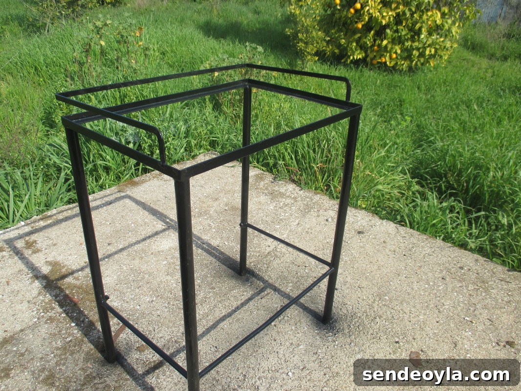Spray painted black, A rusty old Table Revived www.theboondocksblog.com