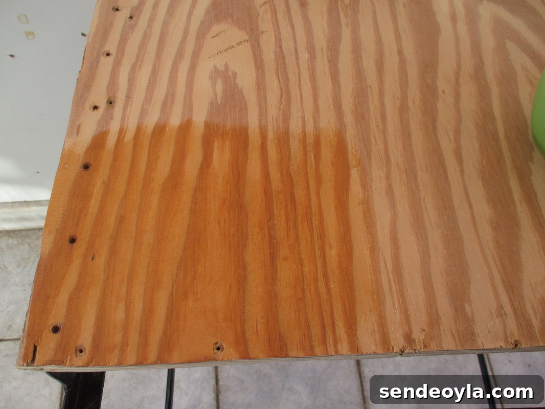 Cleaning it with oil and vinegar, A rusty old Table Revived www.theboondocksblog.com