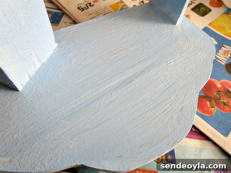 Transform Vintage Book Trough into Stylish Decor 4 Painting the vintage book shelf with chalky finish paint
