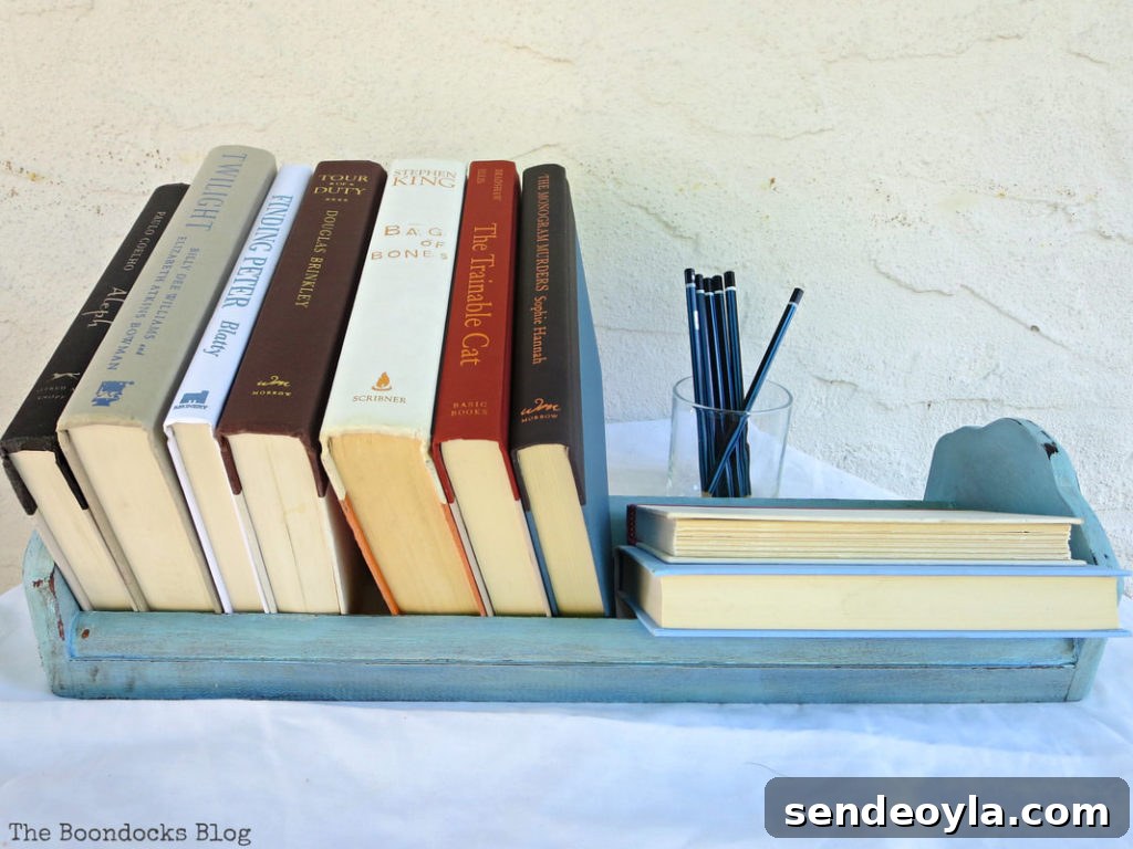 Transform Vintage Book Trough into Stylish Decor 7 The finished upcycled vintage book shelf.