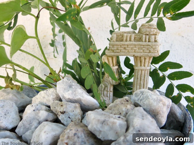 Upcycled Beach Vignette Ideas for Coastal Decor 14 Vinca vine inside the planter, Using Pebbles to Inspire My Love of the Beach www.theboondocksblog.com