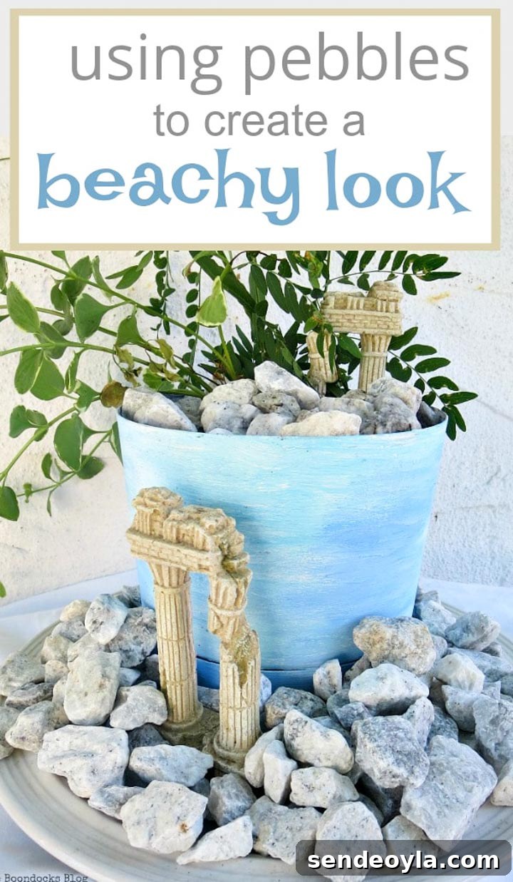 Upcycled Beach Vignette Ideas for Coastal Decor 20 planter with a beachy ancient ruin look, #beachysummerlook #ancientruins #beachyplanter #Mediterranean #plantervignette #containerplanter #pebblerockproject #vincavine #easyproject #upcycledplanter Using Pebbles to Inspire My Love of the Beach www.theboondocksblog.com