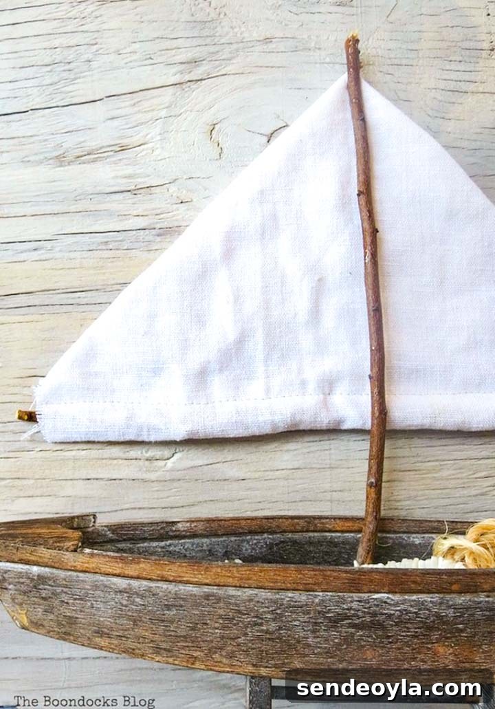 Coastal Wall Art Made from Repurposed Beach Finds 19 The sailboat created from items found in a dresser