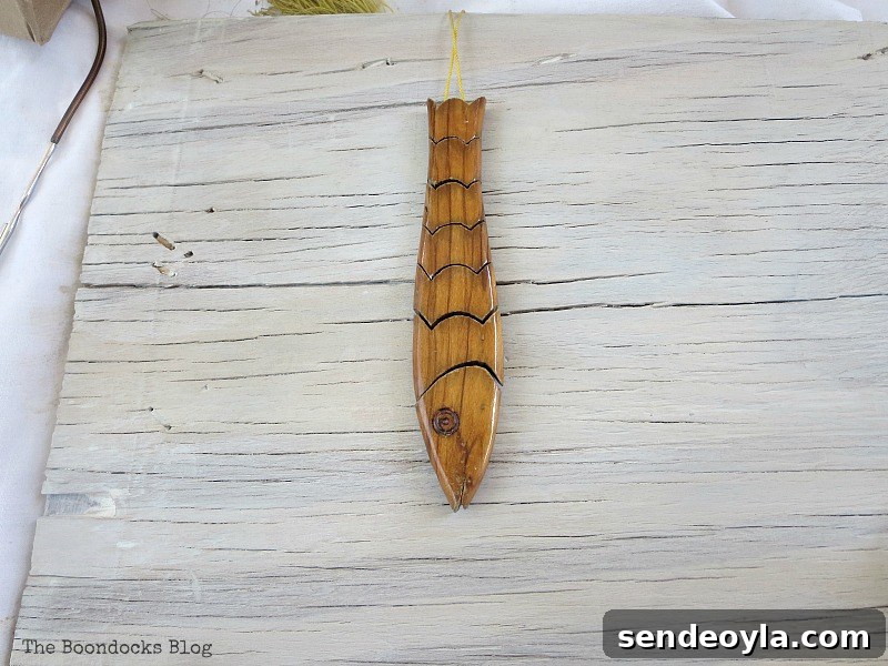 Coastal Wall Art Made from Repurposed Beach Finds 6 Fish-shaped worry beads found in dresser drawer
