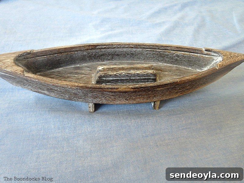 Coastal Wall Art Made from Repurposed Beach Finds 9 Old wooden boat repurposed for beach art