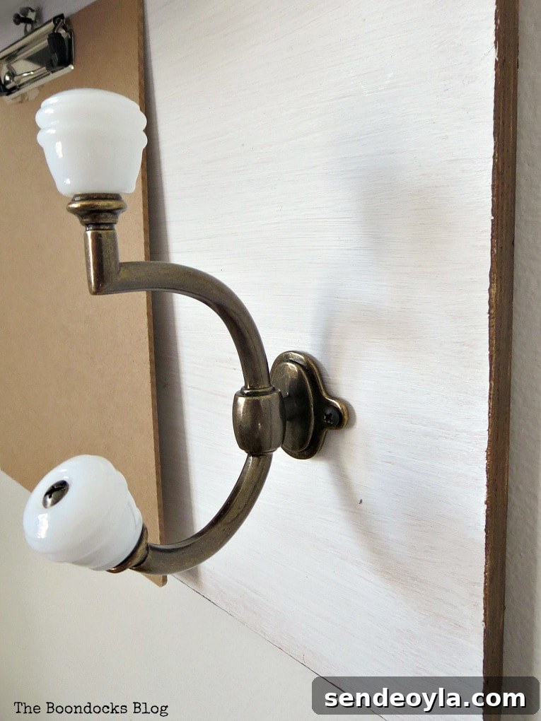 Milk White Barrel Glass Knob & Oil Rubbed Bronze Coat Hook.