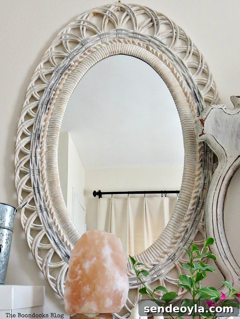 Oval plastic mirror frame painted with white, grey and peach
