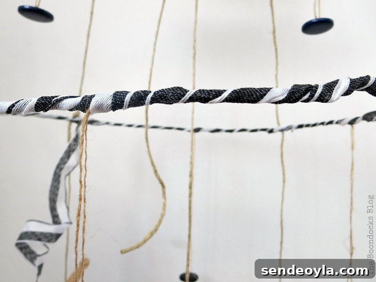 Close up of ribbon wrapped around the third tier mobile.
