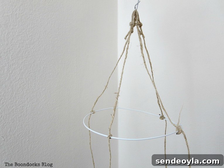 Making loops from the twine to make a mobile.