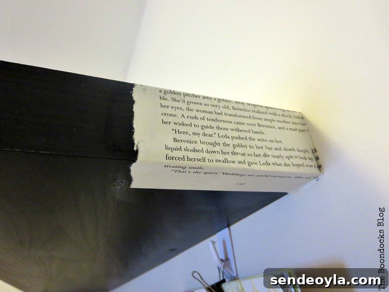 DIY Shelf Makeover with Book Pages 4 book pages being applied around the edges