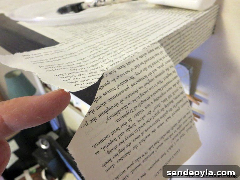 DIY Shelf Makeover with Book Pages 5 applying book pages to the corner of the shelf