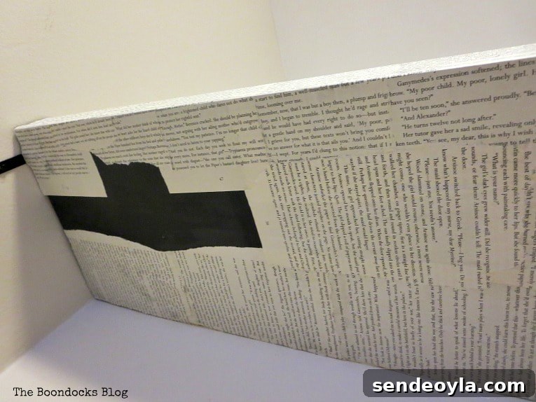 Applying book pages to the bottom of the shelf