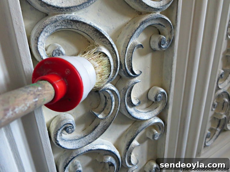 Paint and Restore a Vintage TV Cabinet: DIY Guide 12 adding color to the scroll work with slate milk paint, How to Revive a Vintage TV Cabinet www.theboondocksblog.com