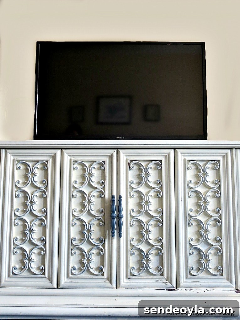 Paint and Restore a Vintage TV Cabinet: DIY Guide 14 The TV on top of the TV Cabinet now used for storage, #furnituremakeover #Vintagefurniture #SeventiesTVCabinet #OldFashionedMilkPaint #TVCabinetasstorage #ScrollworkonTVCabinet How to Revive a Vintage TV Cabinet www.theboondocksblog.com