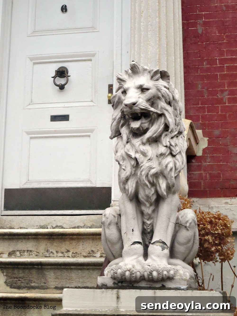 Explore Greenwich Village: Iconic Sights and Hidden Gems 10 Row house with lion sculpture, Interesting things to see in Greenwich Village