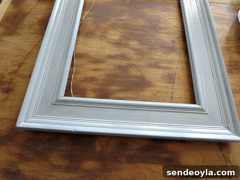 Frame painted a soft metallic gray