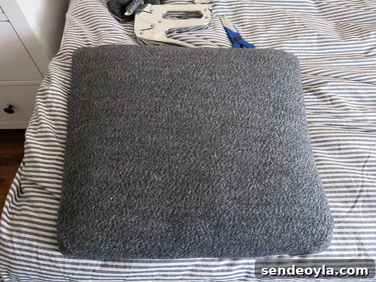 DIY: Turn One Chair Into Two Distinct Makeovers 6 Covering the seat with an old sweatshirt, How to Get Two Unique Makeovers from One Chair www.theboondocksblog.com