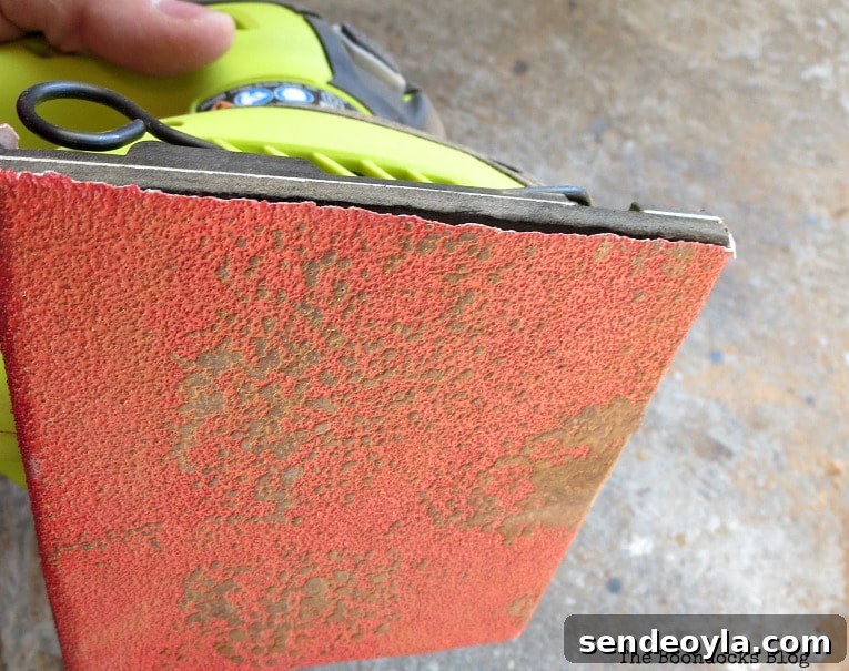 DIY Wooden Stool Makeover: Transform It Into a Chic Seat 7 The stain from the legs of the bench on the sandpaper, The Not So Simple Transformation of a Bench