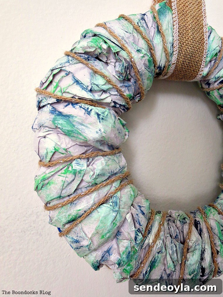 Close up of an easy DIY wreath made with colorful packing paper.