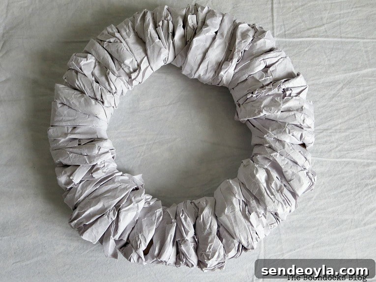 Wrapped cardboard wreath.
