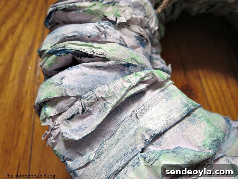 Green, blue and white paint on packing paper.