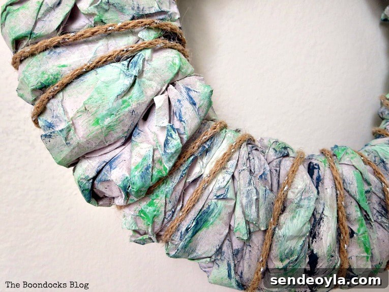 Twine wrapped around packing paper wreath.
