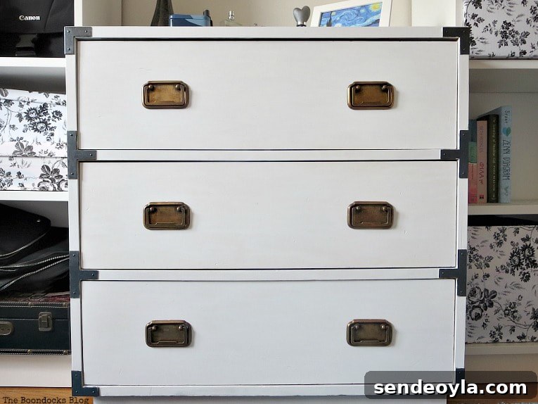 Refinish and Restore a Campaign Dresser in 7 Steps 10 Finished dresser after being painted white and updating the hardware.